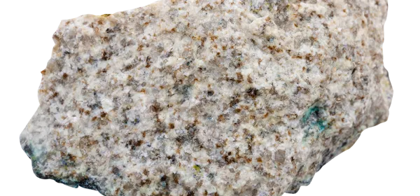 Close-up of lithium mica granite sample, showcasing mineral-rich texture used in lithium extraction for batteries and clean energy.